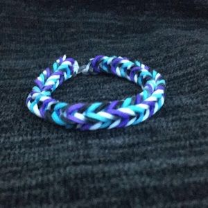A purple,blue,black, and white bracelet